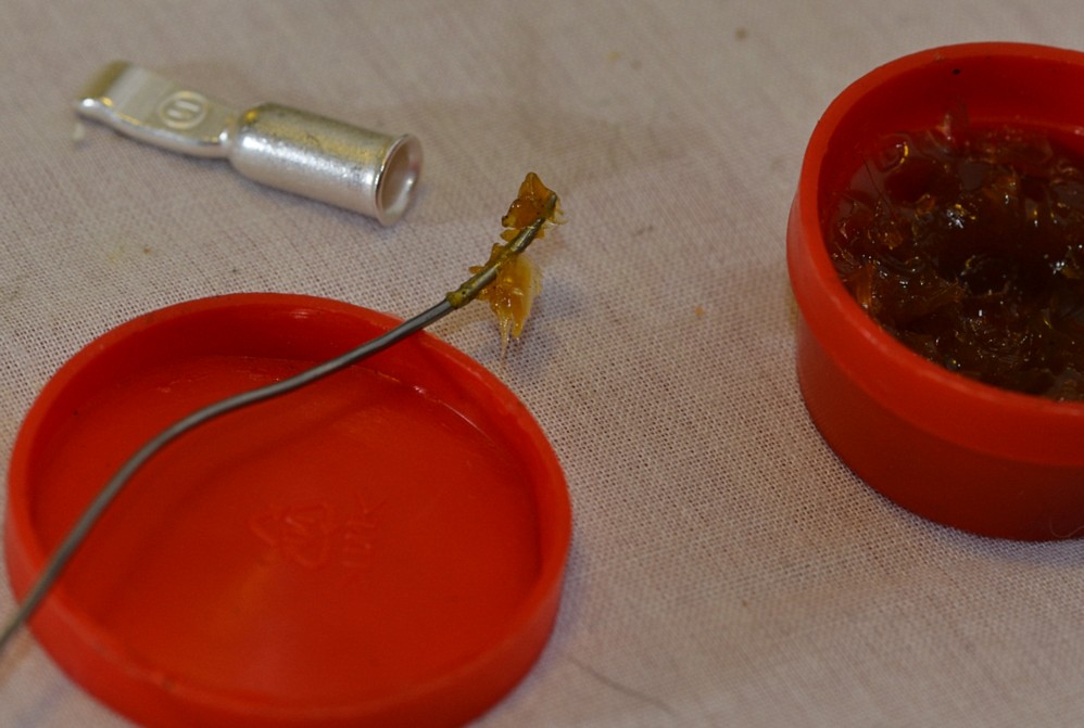 Soldering flux being applied to a connector