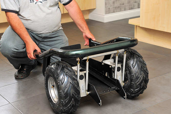 Wheelchair sat on fat knobby tyres