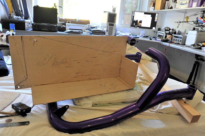 Frame cut, wooden mock-up of new centre section in position for new powerchair